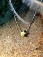 Tiny gold star necklace